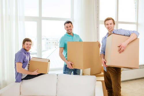 Packed sofas and dining furniture prepared for storage