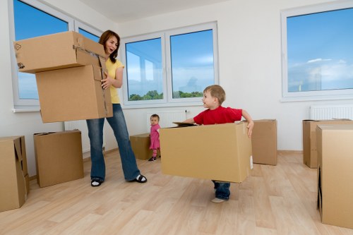 Packed office boxes and furniture ready for Leabridge relocation
